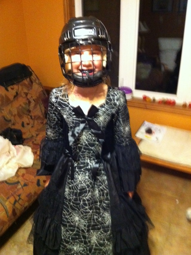 Girl in Halloween costume and helmet