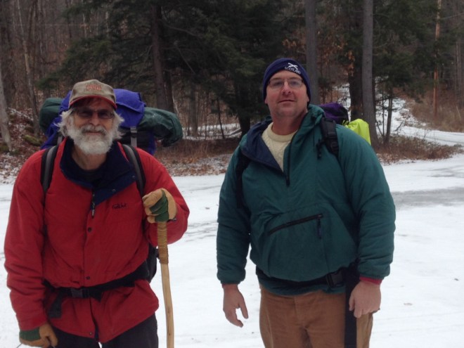 Two men winter camping in park