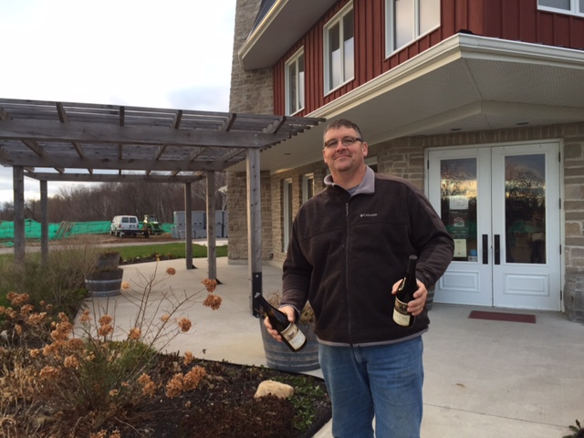 Man holding two bottles of wine