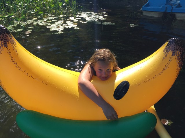 Girl riding beach toy