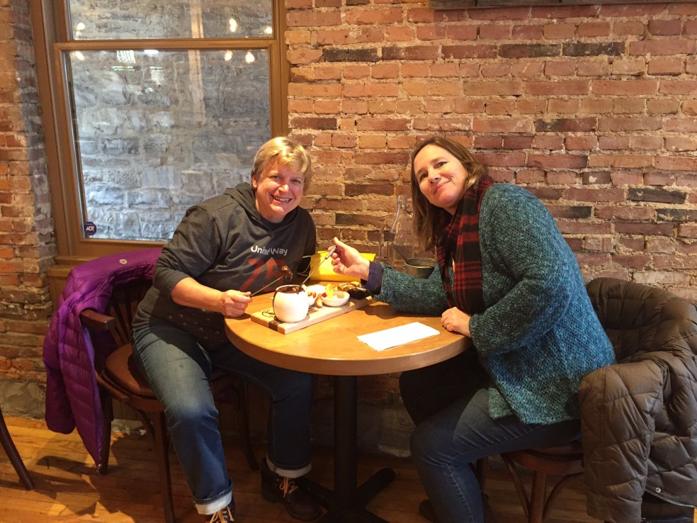 Friends eating chocolate fondue