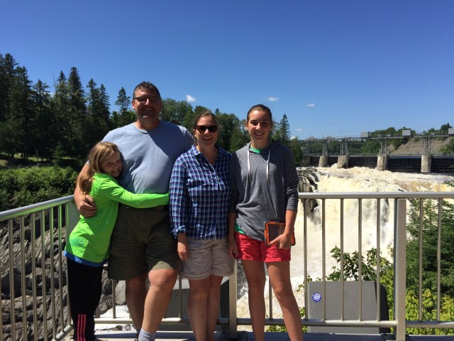 Swinton family in front of waterfall