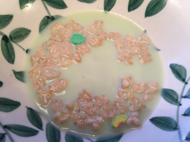 green milk in bowl of lucky charms
