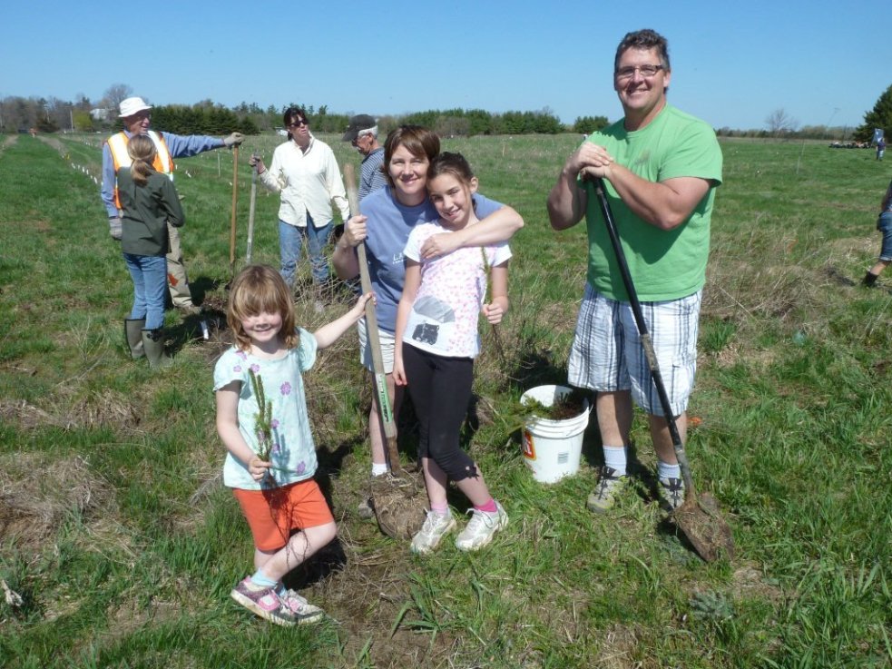 Family planting trees