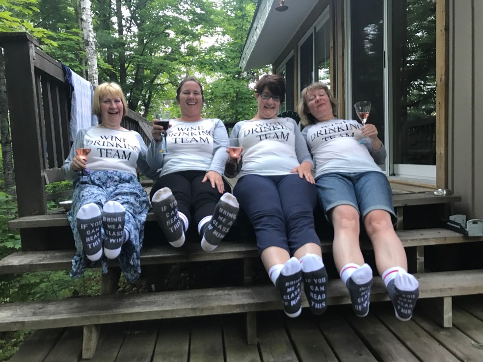 Girls wearing wine drinking team tshirts and socks