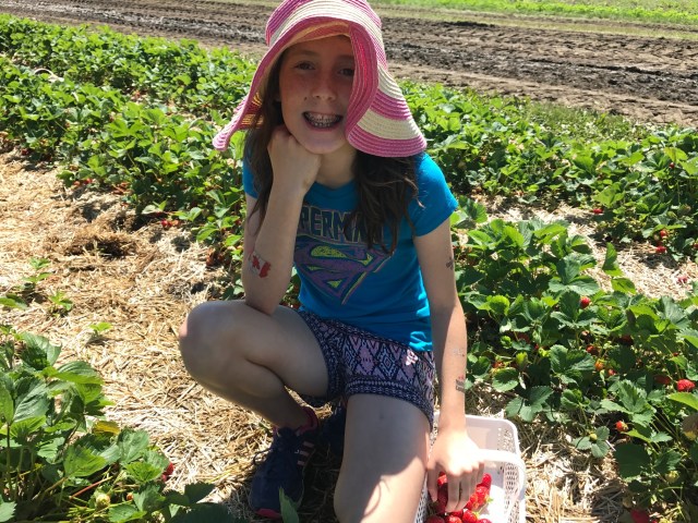 Girl with strawberry basket