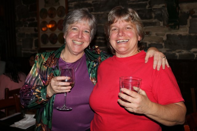 Two women with drinks celebrating