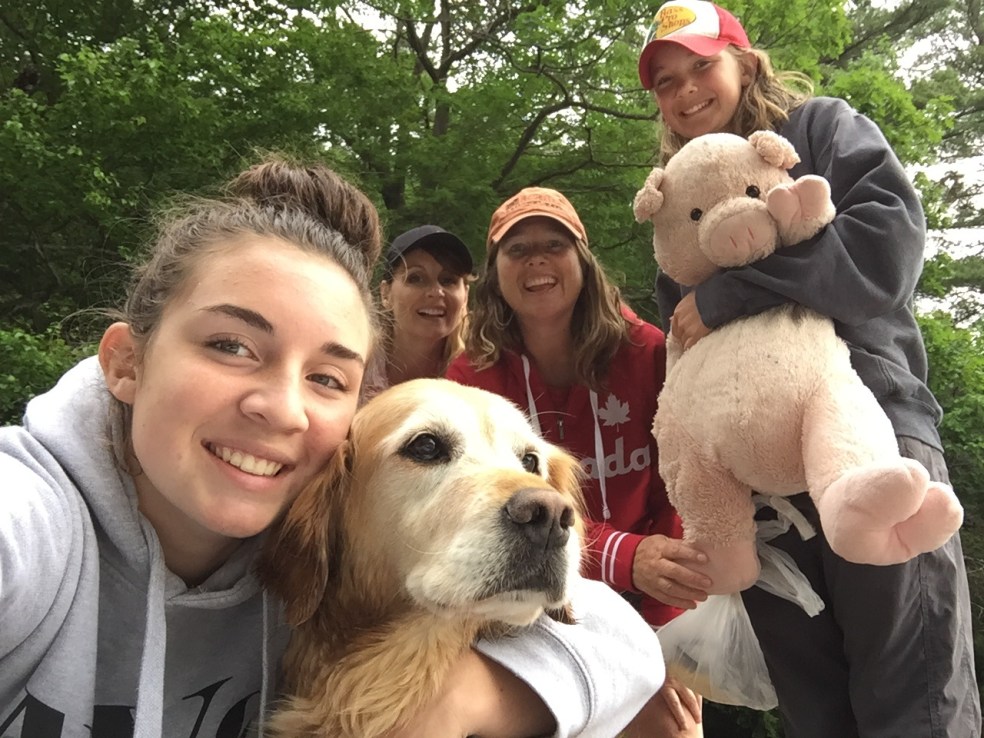 Girls and dog at cottage