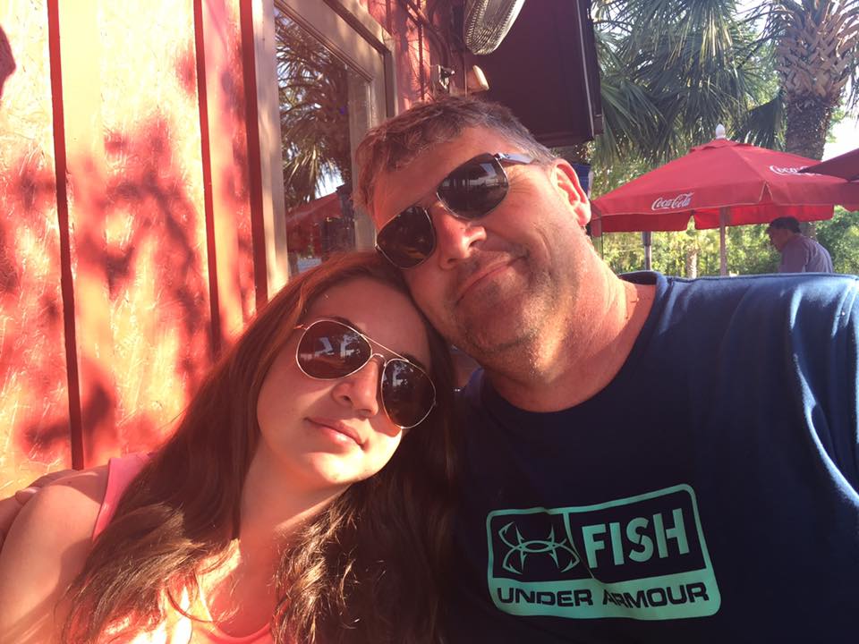 Father and daughter on patio