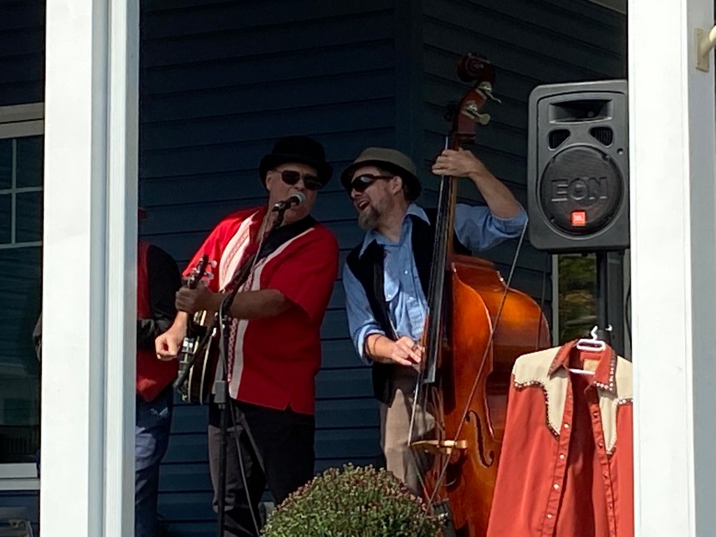Musicians performing on the porch at Westporch