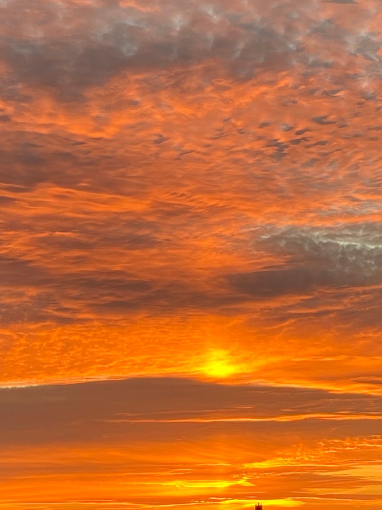 Orange sun and clouds