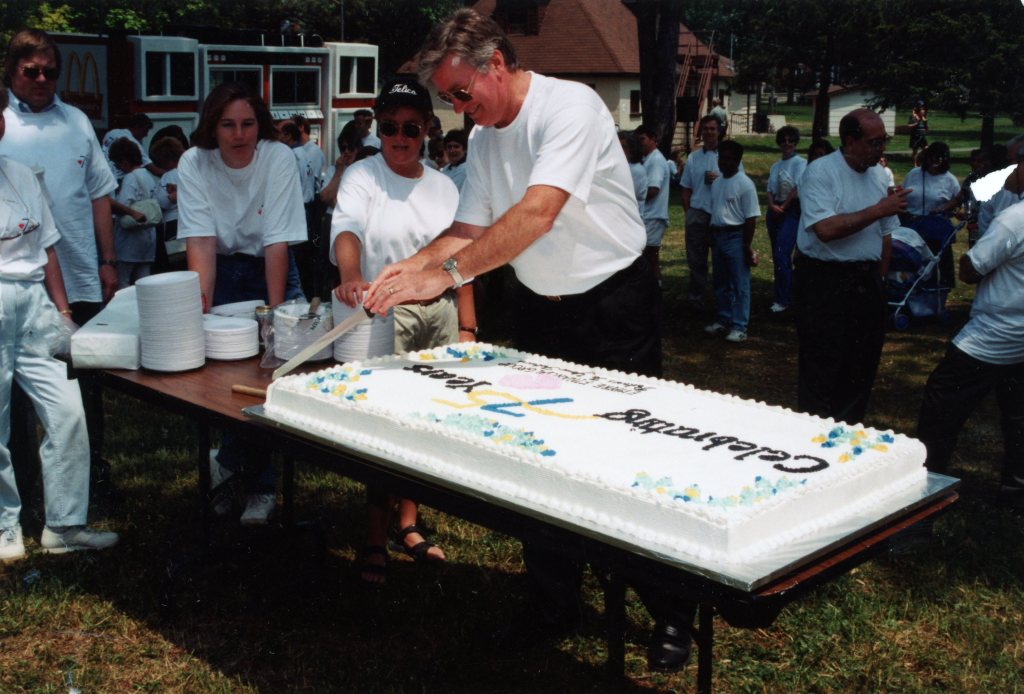 Serving cake at my company's 75th anniversary