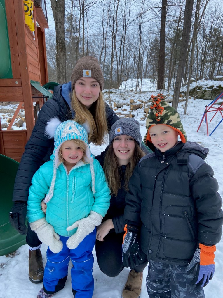 Teenagers Grace and Clare with two children next door