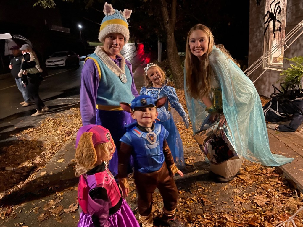 Clare trick or treating with the neighbourhood kids