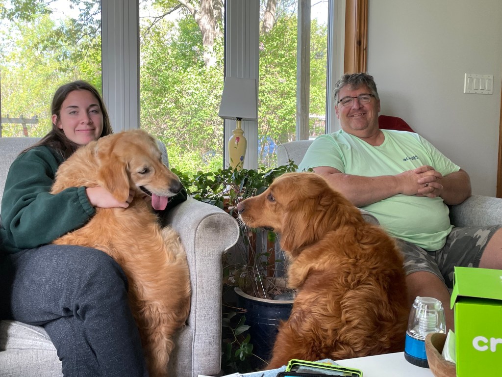 Grace, Dave and two golden retrievers