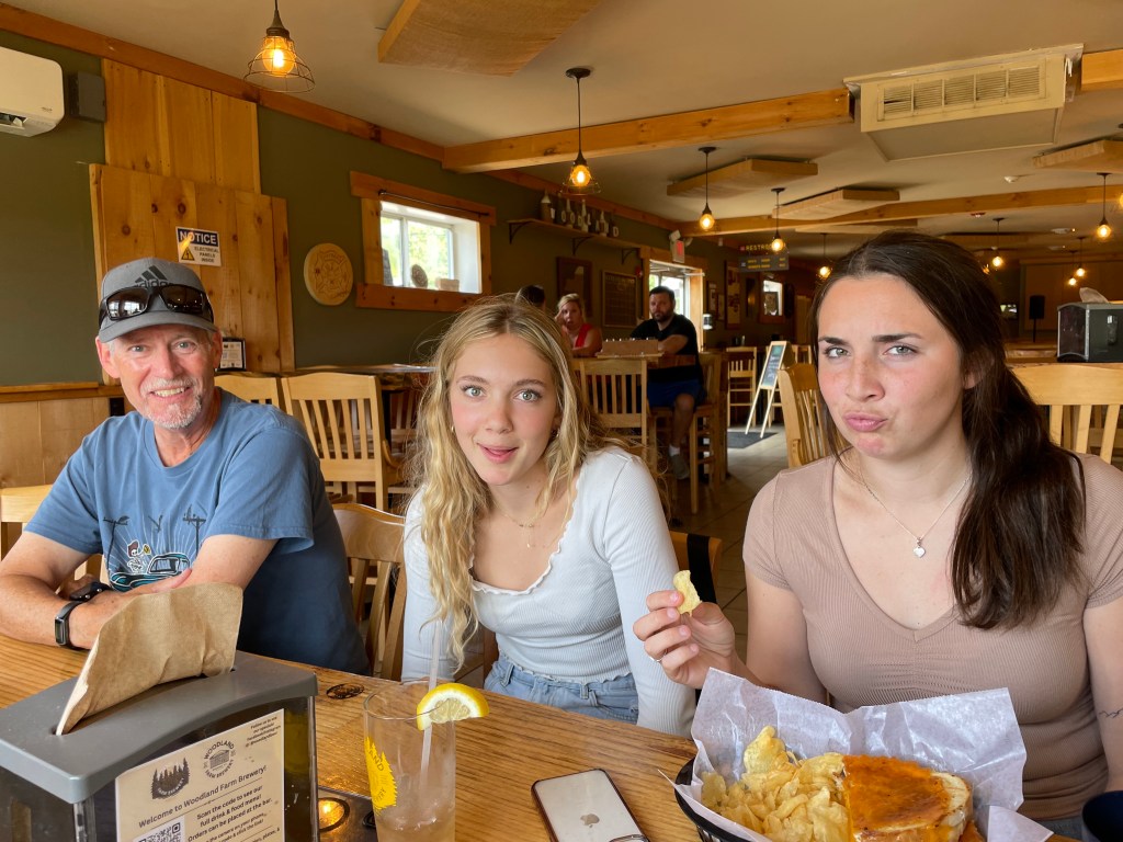 Clare and Grace and their Uncle Don at a local brew pub