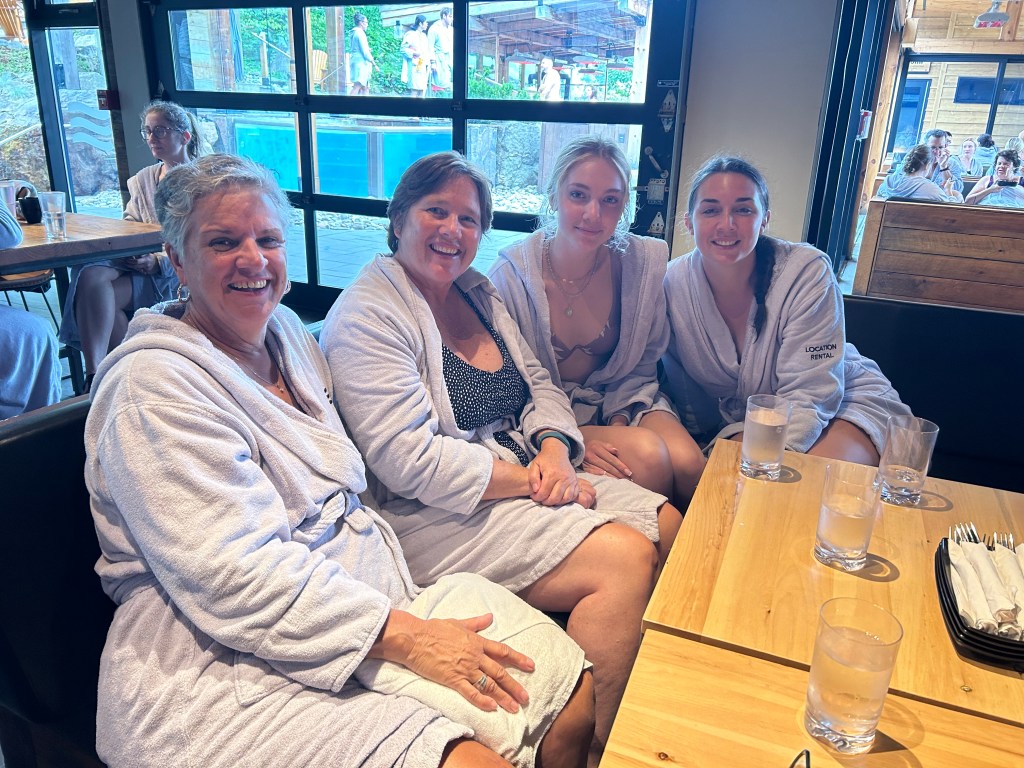 Four ladies in spa robes having lunch at Nordik Spa in Chelsea, QC