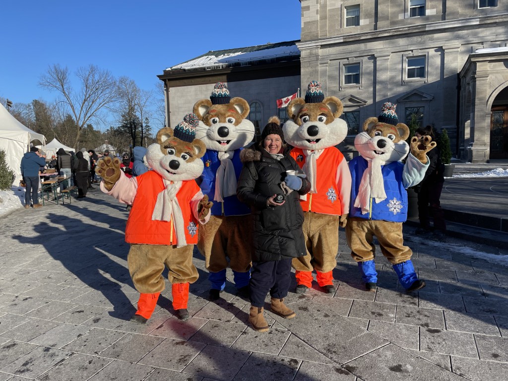 Author and winterlude mascots outside of Rideau Hall