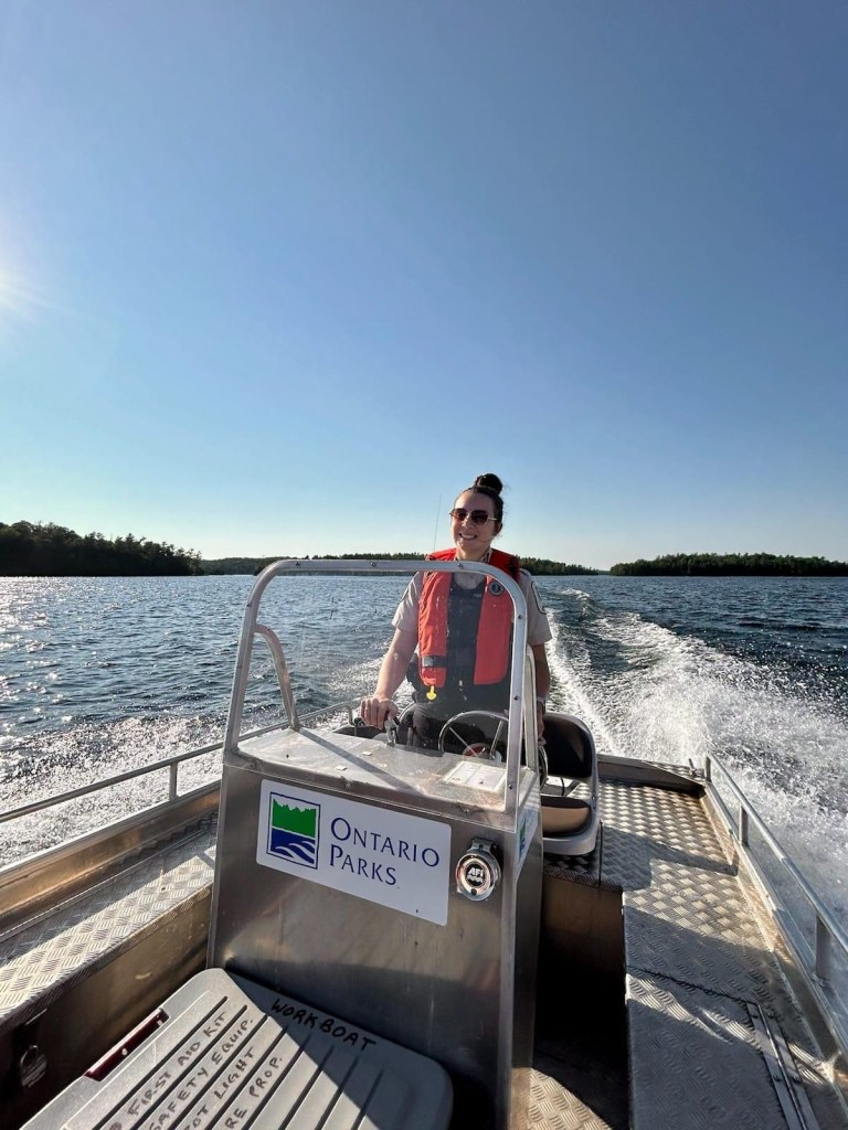 Girl driving Ontario Parks boat