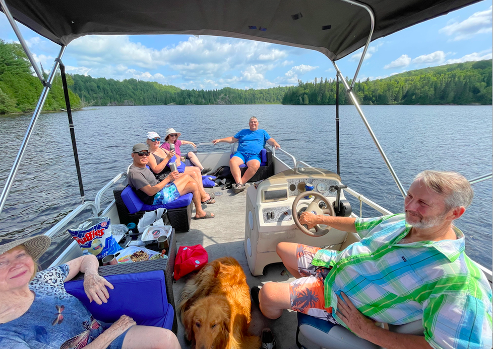 People on a pontoon boat ride