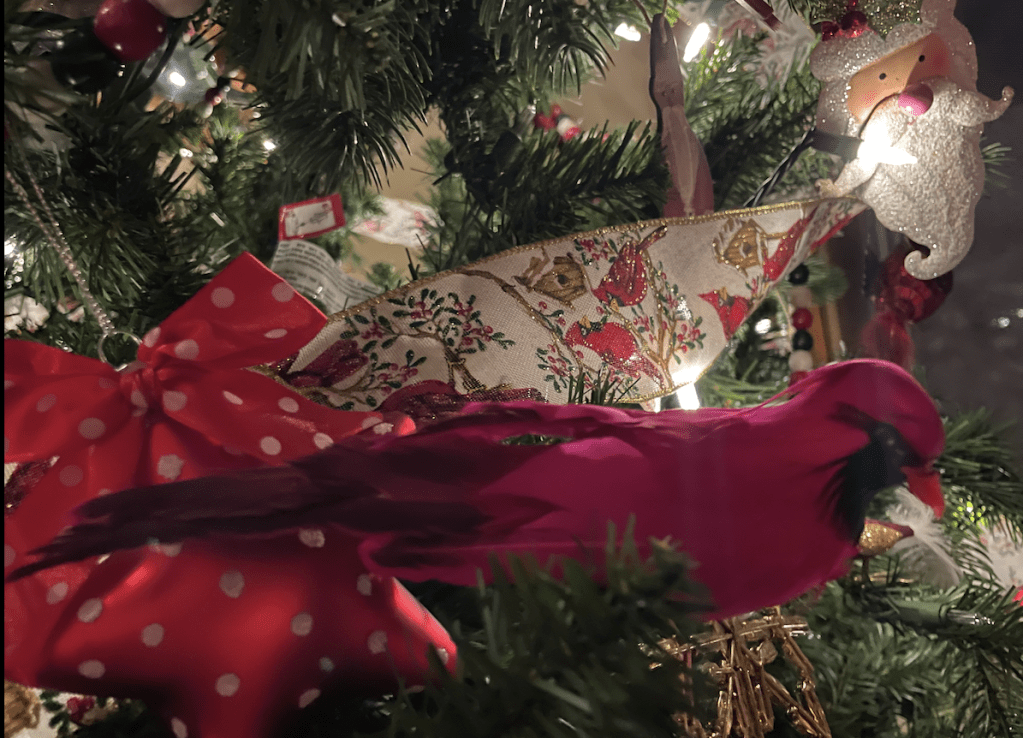Cardinal and cardinal garland on a Christms tree