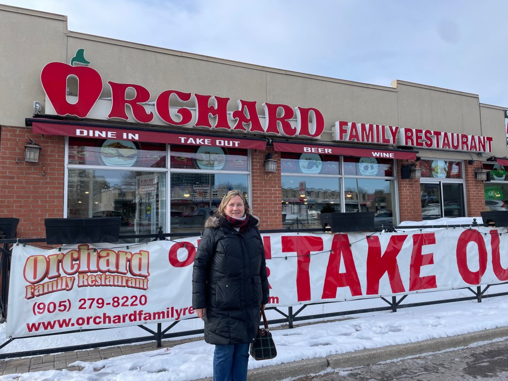 Me standing in front of The Orchard Family Restaurant in Mississauga