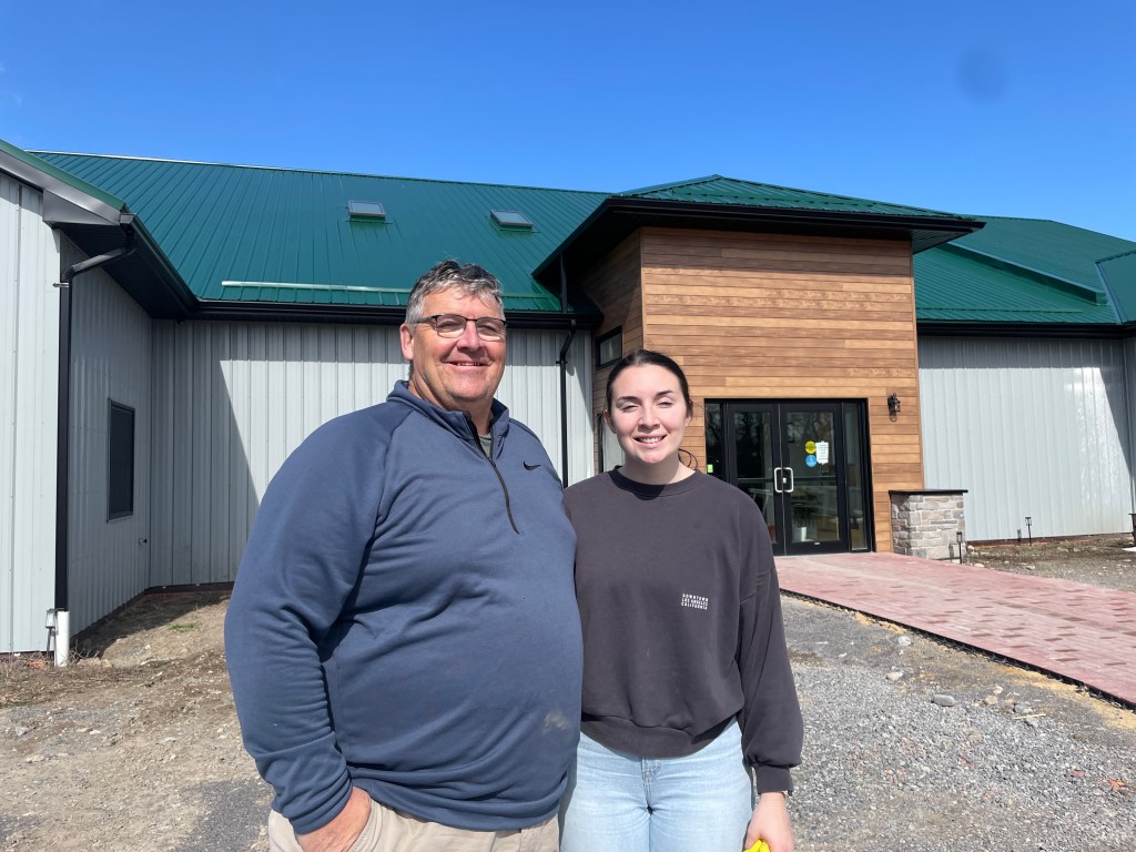 Man and girl in front of the Ontario Turtle Conservation Centre in Peterborough, Ontario