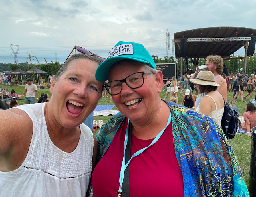 Two women at an outdoor music festival
